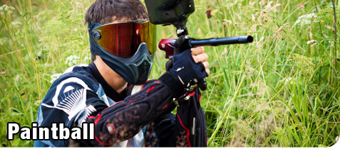 Young Man Hinding in the Brush During a Recreational Game of Paintball